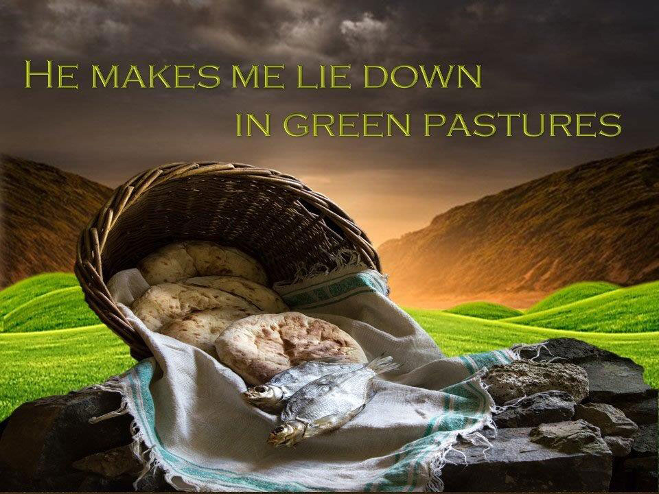 Basket with loafs of bread with mountain background and green pastures